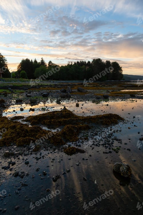 Preview: Rocky beach during a vibrant cloudy summer sunset