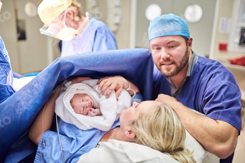 Preview: Shot of a beautiful young couple welcoming their newly born baby girl in the hospital