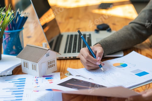 Preview: House models, real estate tycoons are analyzing earnings through data analytics graphs.