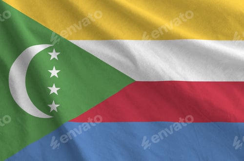 Preview: Comoros flag depicted on folded wavy fabric of old cloth