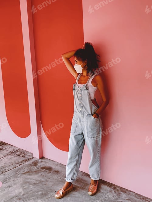 Preview: Woman posing with hand on her hair.