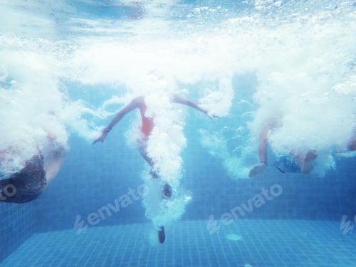 Preview: An underwater shot of a group of people jumping down into a swimming pool