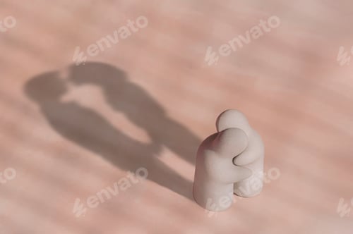 Preview: Little terracotta garden figurine in hug gesture with shadow of kissing couple on pink background