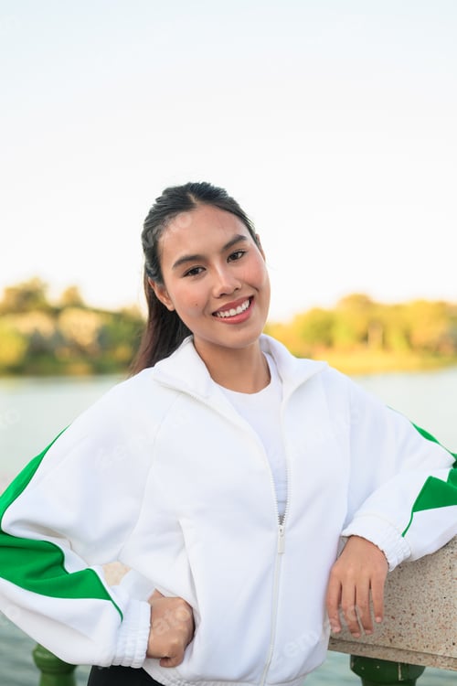 Preview: Young Asian Woman in Sporty Casual Outfit Outdoors in Lake Garden