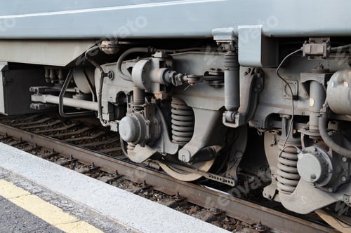 Preview: Detailed view of train undercarriage showcasing suspension system