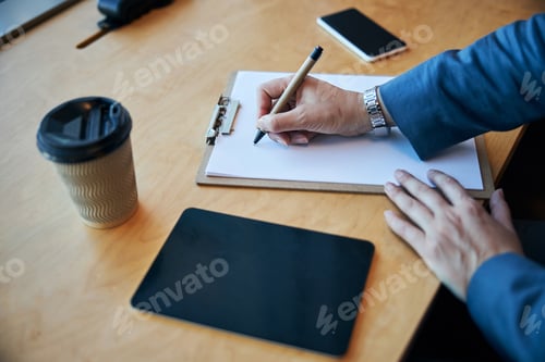Preview: Female hand writing on sheet of paper