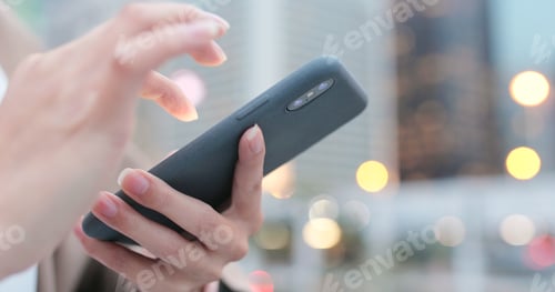 Preview: Woman use of smart phone at night