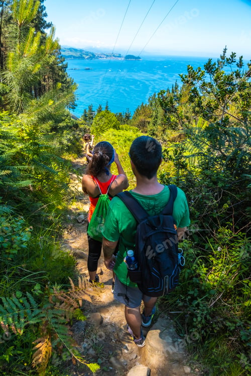 Preview: Three friends on the path down to the town of Orio, Guipuzcoa, Basque Country