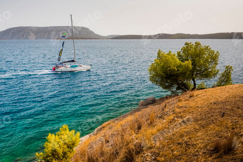 Preview: Sailing holiday to Greece, with sailing boats in teh beautiful blue ocean at Ermioni, Peloponnese, E