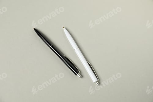 Preview: Stylish pens on grey background, flat lay