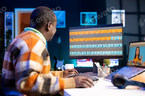 Preview: Professional man in creative setup at home uses digital tools for graphic design