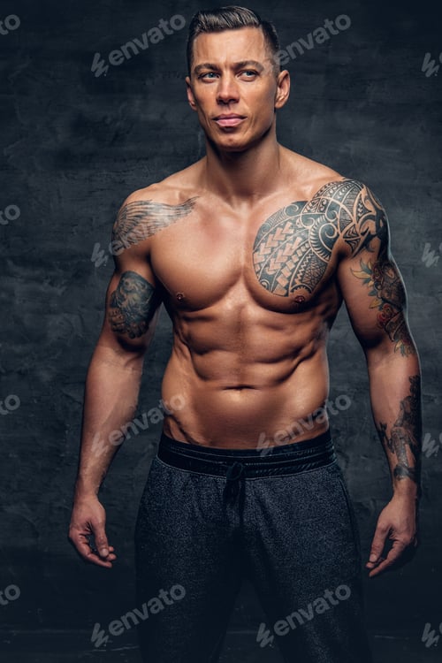 Preview: Muscular man fitness model with tattoo on his chest.