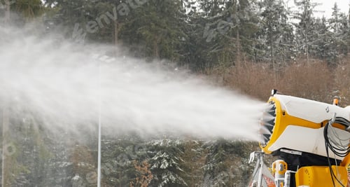Preview: Snow cannon makes artificial snow. Snowmaking systems sprays water to produce snow.