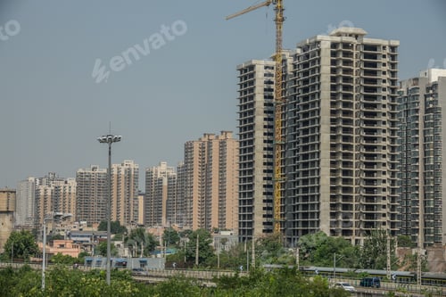 Preview: Wide angle shot of several skyscrapers built next to each other under during daytime