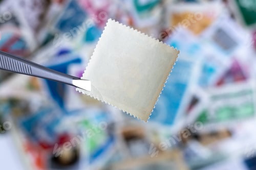 Vista previa: Blank square postage stamp against blurred background collection of postage stamps