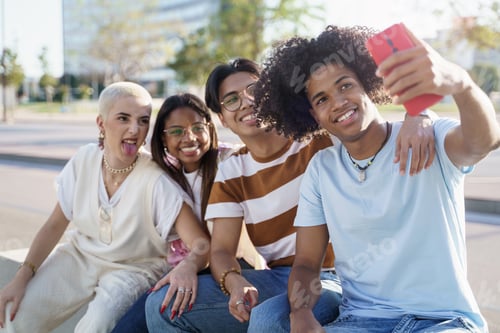 Preview: African American Young man takes selfie with group of teenager friends
