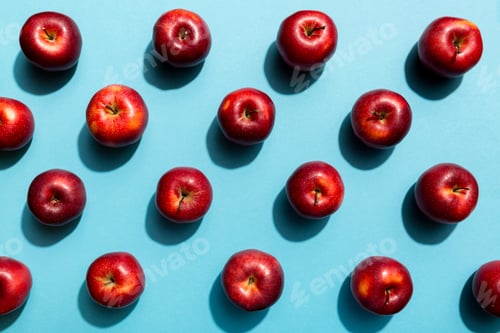 Preview: Many red apples on colored background, top view. Autumn pattern with fresh apple above view