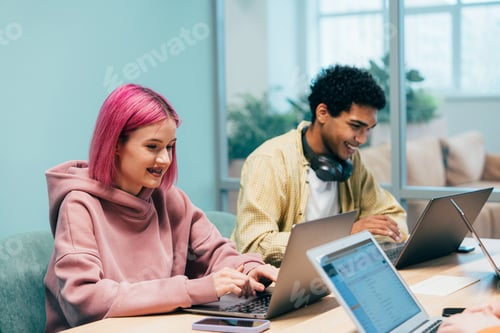 Preview: young programmers working on a new project for a start up business.