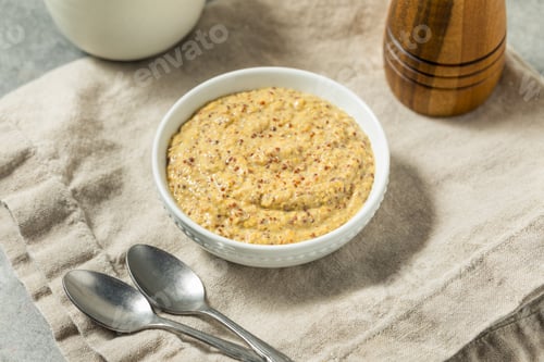 Preview: Bowl of Mustard on Neutral Background with Spoons