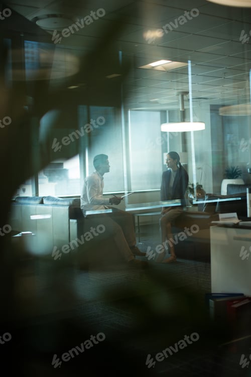 Preview: Business people interacting with each other during meeting at office