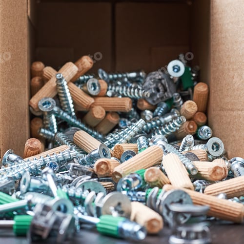 Preview: Open box with fall out tools for a furniture assembly, closeup