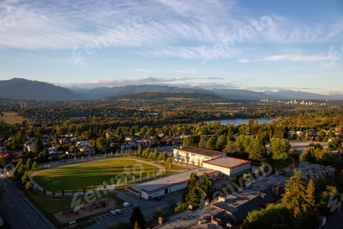 Preview: Aerial view of the modern city during a vibrant summer sunset