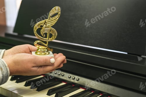 Preview: Victory trophy in shape of treble clef held by woman, celebrating festival success