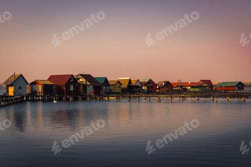 Preview: Beautiful shot of houses in the sea with a scenery of sunset