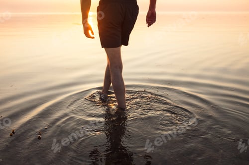 Preview: Strolling through tranquil waters at sunset