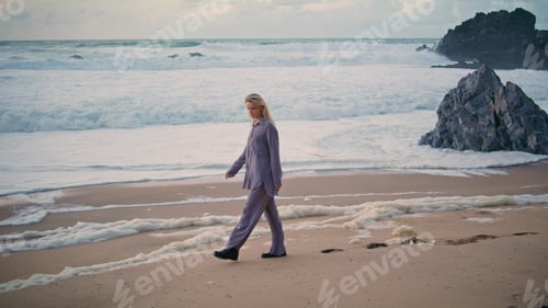 Preview: Relaxed girl stepping beach on ocean evening. Beautiful traveler resting shore