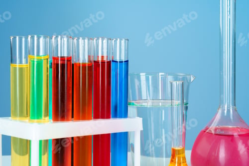 Preview: Chemical laboratory glassware with various colored liquids on table