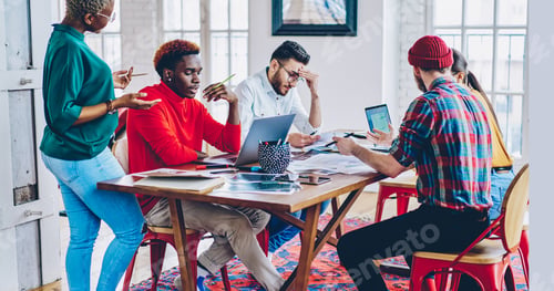 Preview: Young hipster guys discussing web projecting and graphic design of business