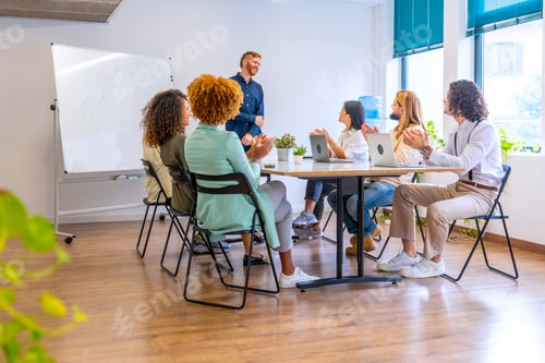 Preview: Meeting of young team work in a coworking room
