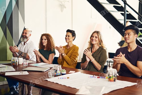 Preview: Shot of a group of businesspeople applauding in an office