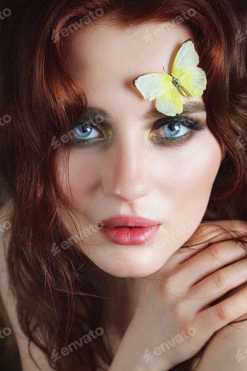 Preview: Portrait of tender girl with butterflies on her face and body