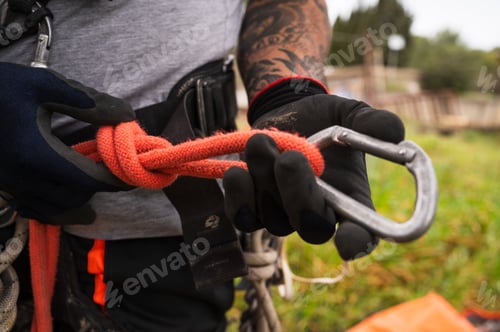 Preview: close-up of a technician holding a carabiner