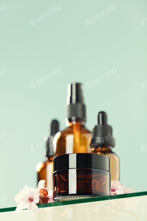 Preview: Amber glass bottles, cream jar and cherry blossom branches