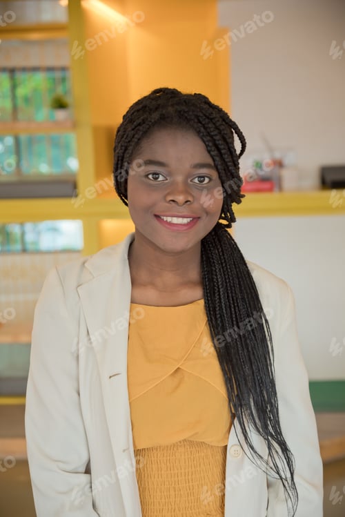 Preview: Portrait of a woman african on library or working space and smile