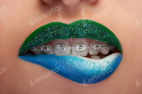 Preview: Close up mouth blue and green lips with glitter brackets