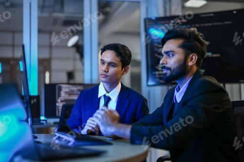 Preview: diverse team of AI developers shares a successful moment in the office.