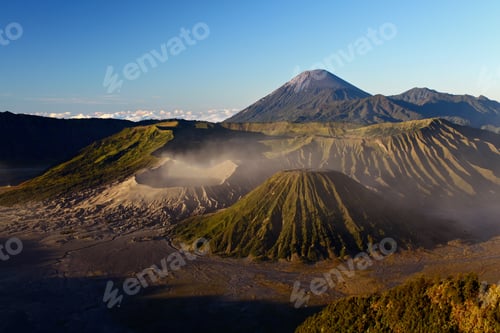 Preview: Horizontal shot of the beautiful Bromo volcano covered in fog under the clear sky