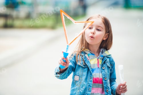 Preview: Girl making soap bubbles