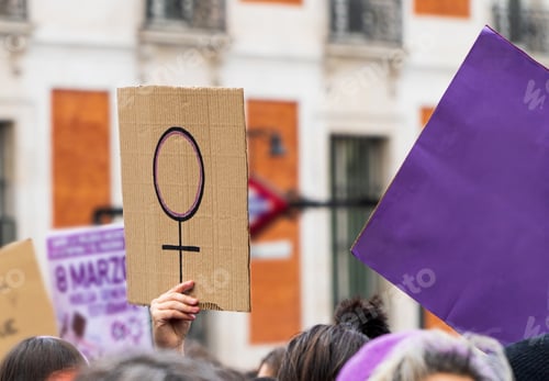 Preview: Women hands supporting feminist symbol placard on 8 M demonstration