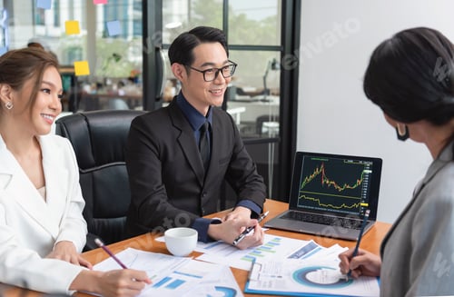 Preview: Asian businesspeople meeting about business plan and present and explain financial chart from laptop