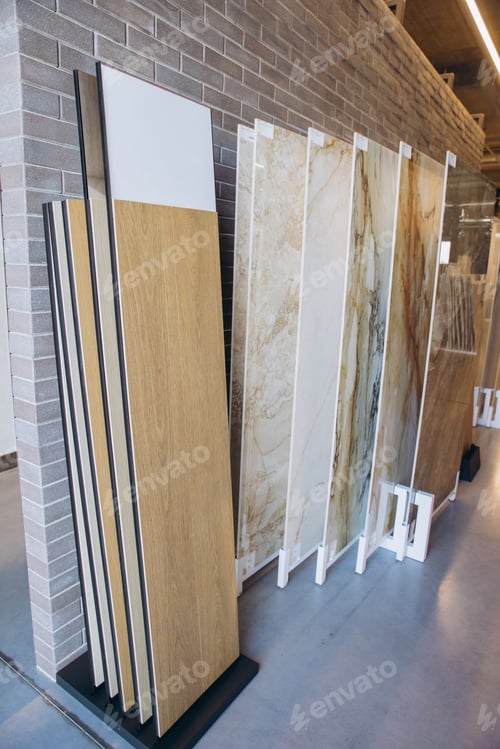 Preview: Interior design showroom displaying various decorative material samples including wood effect