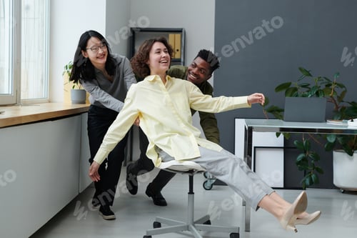 Preview: Business people having fun in office