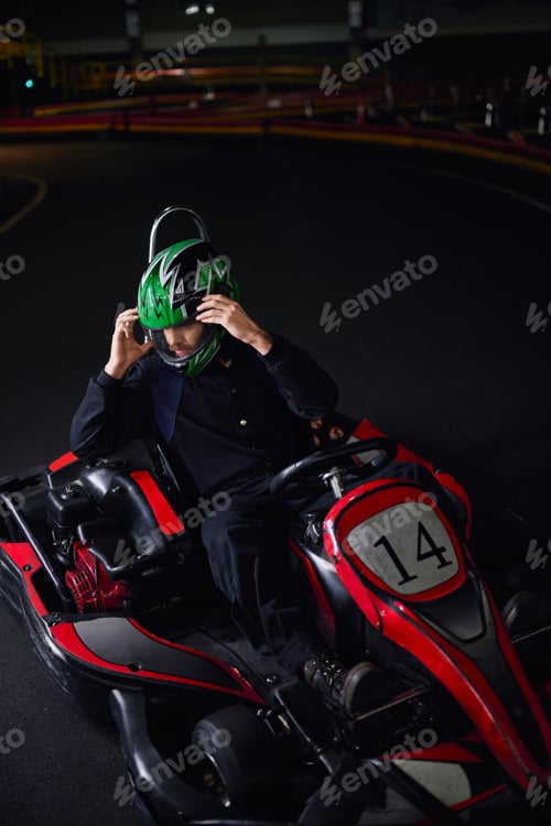Preview: Go Kart Driver Adjusting Helmet Before Race