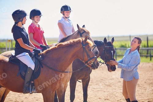 Preview: Coach and girls on horses on riding ring