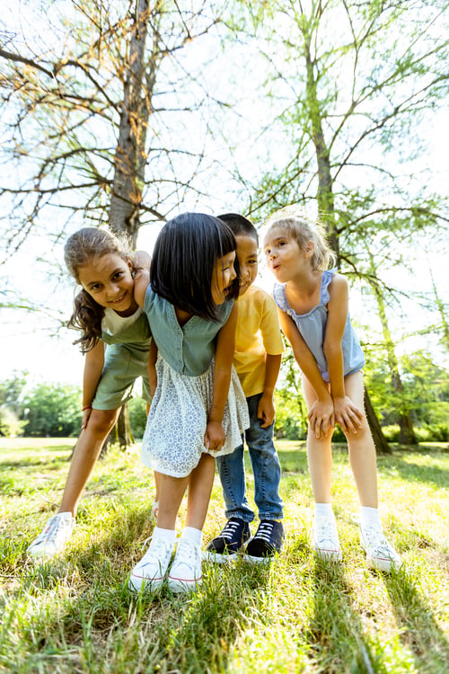 Preview: Group of asian and caucasian kids having fun in the park