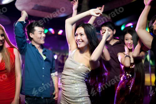 Preview: Stylish young people dancing in nightclub